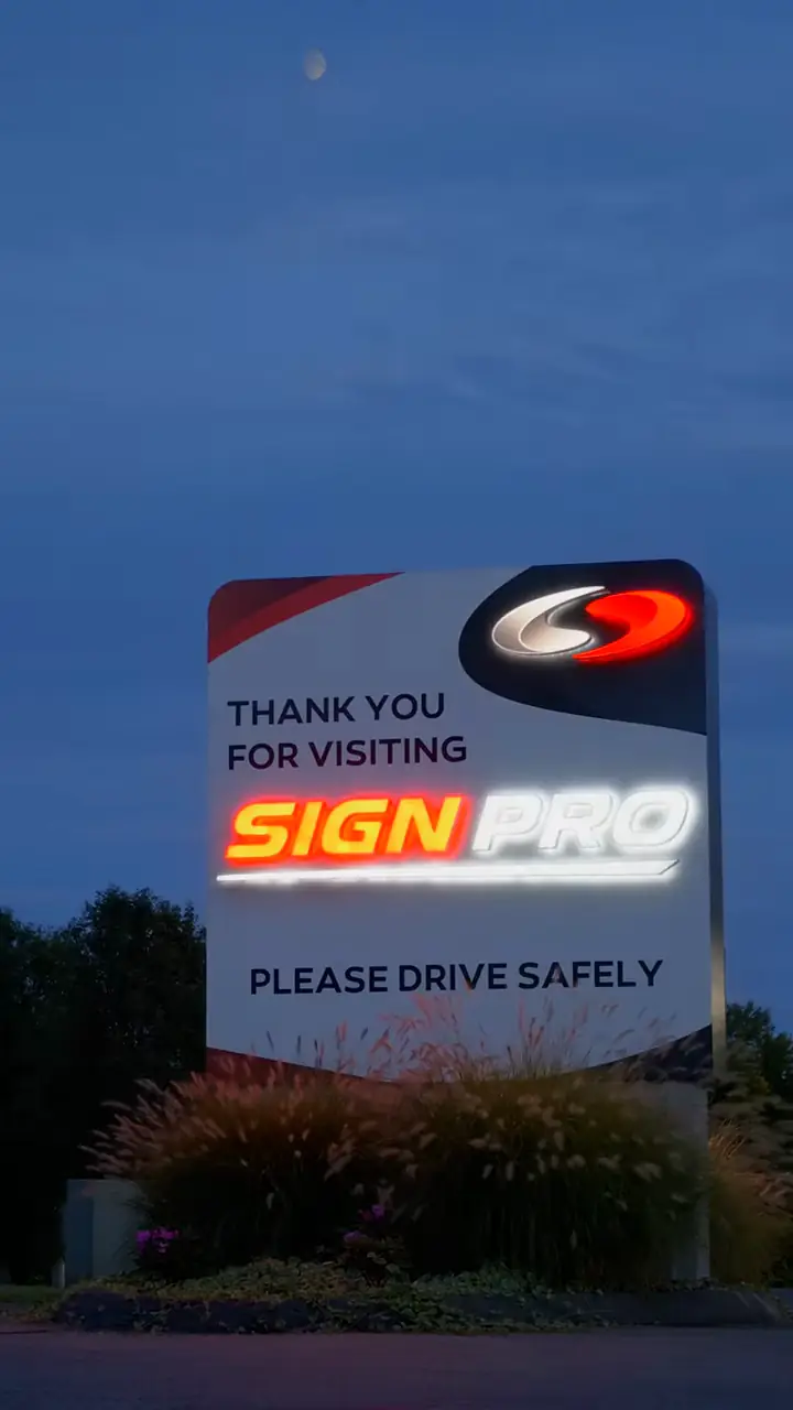 Sign Pro’s “Thank you for visiting” sign lit at dusk