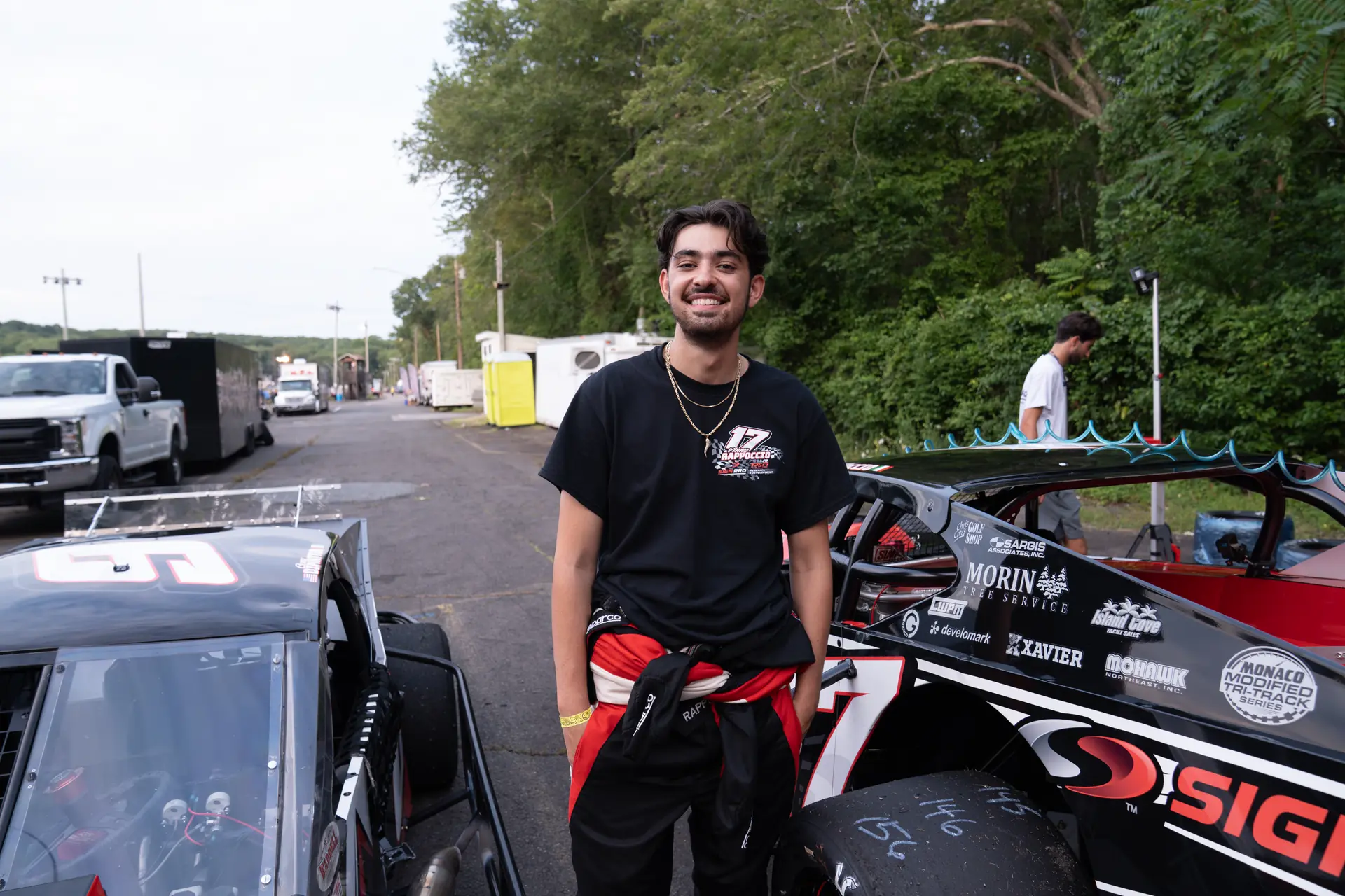 Vinny Rappoccio beside the Sign Pro race car